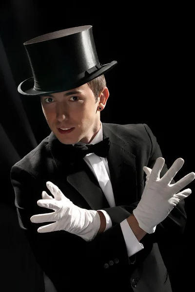 Young magician with high hat Stock Photo
