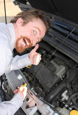 Checking engine oil dipstick