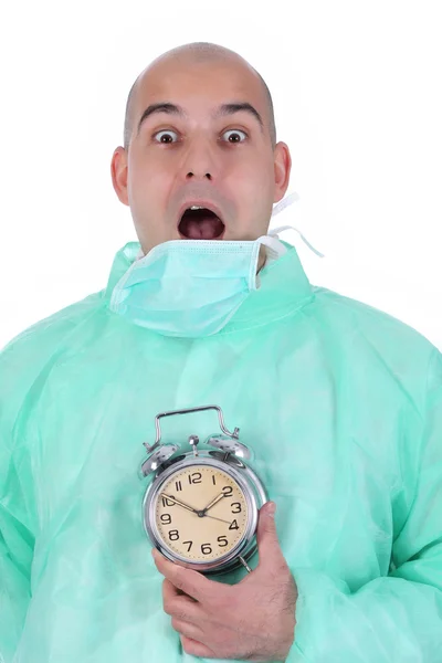 Surgeon and clock alarm — Stock Photo, Image