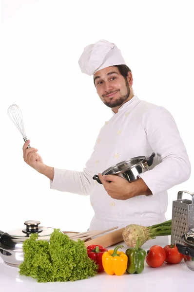 Молодий кухар готує обід — стокове фото