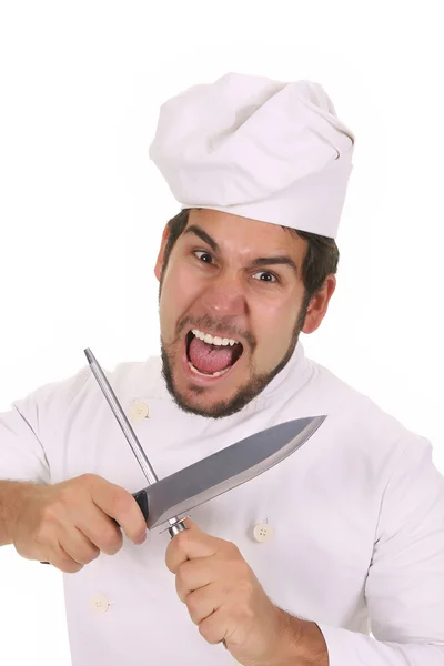 Mad chef sharpening a knife — Stock Photo, Image