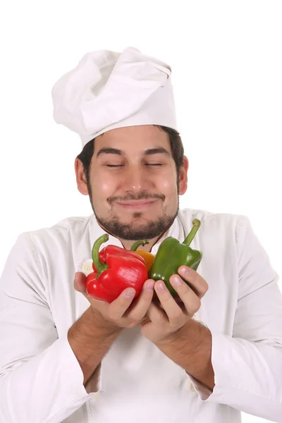 Chef smelling the aroma of peppers — Stock Photo, Image