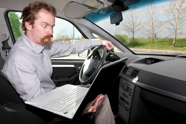 Driver using gps laptop Stock Photo