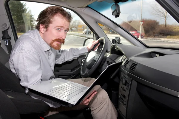 Driver using gps laptop Royalty Free Stock Images