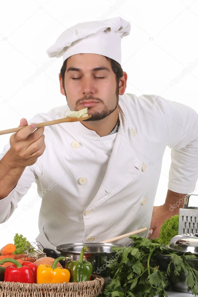 Young chef smelling