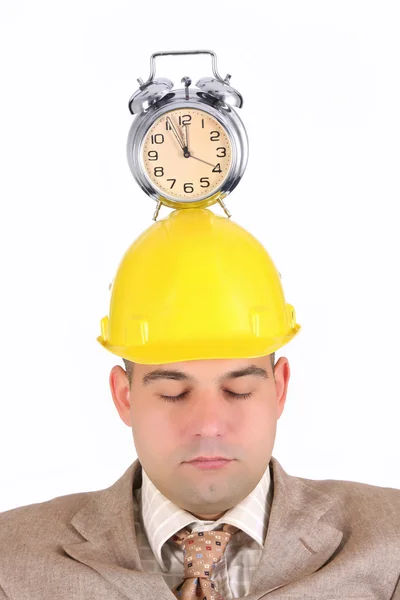 Sleepy businessman with clock alarm — Stock Photo, Image