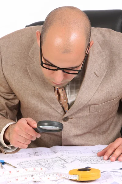 Businessman with architectural plans — Stock Photo, Image