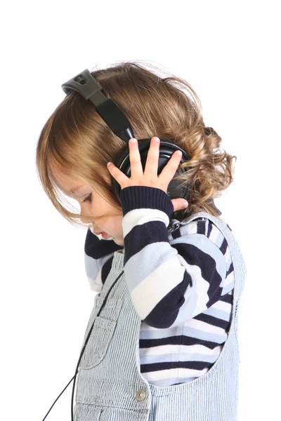 Belleza una niña escuchando música — Foto de Stock