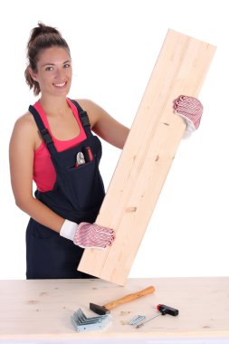 Woman carpenter holding wooden plank clipart