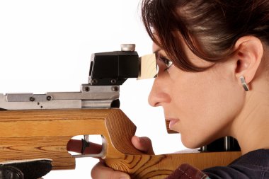 Woman aiming a pneumatic air rifle clipart