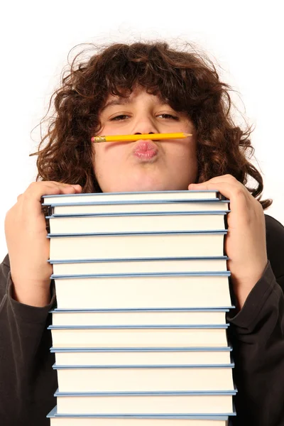 Niño con lápiz y libros — Foto de Stock