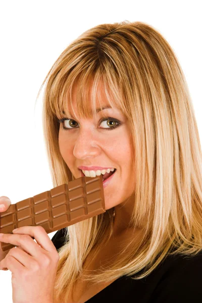 Ung flicka äta choklad — Stockfoto