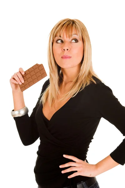 Ung flicka äta choklad — Stockfoto