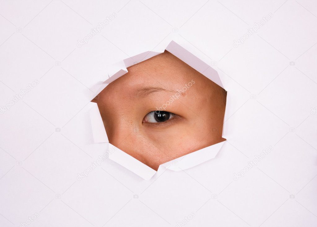 Eye looking through hole