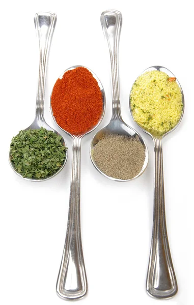 Spices on spoons — Stock Photo, Image