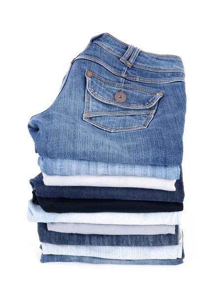 Jeans pila isolato su bianco — Foto Stock