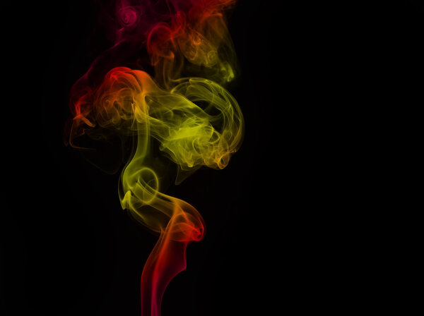 Colorful smoke curves isolated on black background
