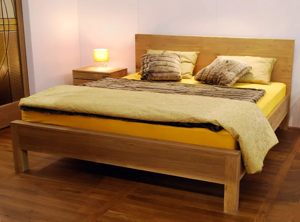 Wooden bed — Stock Photo, Image