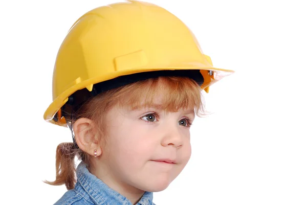 Маленька дівчинка будівельник з жовтим шоломом р — стокове фото
