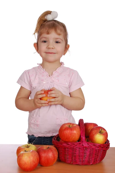 Little girl with apples — Stock Photo, Image