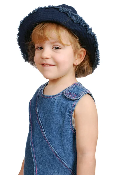 Little girl in blue jeans dress — Stok fotoğraf