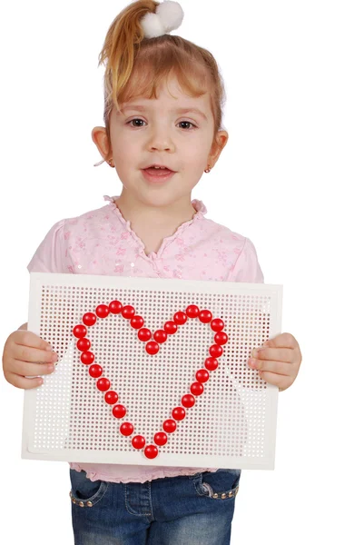 Petite fille avec symbole de coeur — Photo