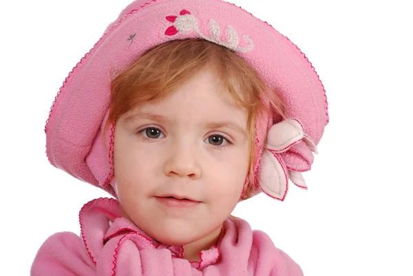 Liten flicka med rosa mössa och halsduk port — Stockfoto