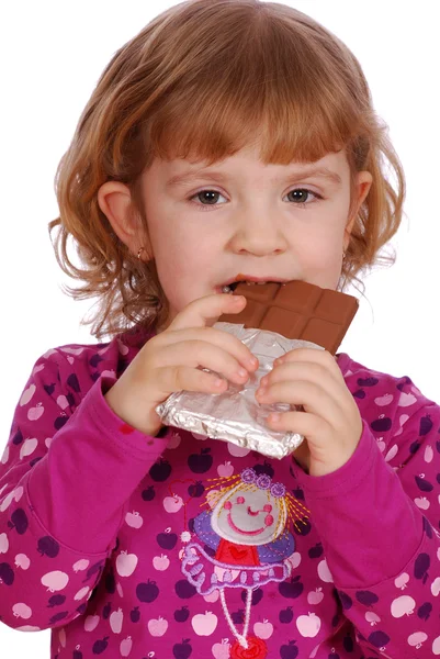 Malá holčička jí čokoládu — Stock fotografie