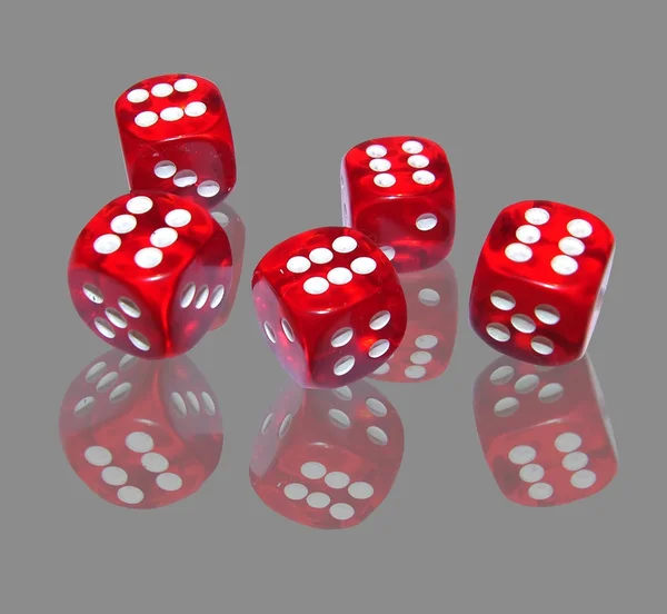 Red dice on grey background — Stock Photo, Image