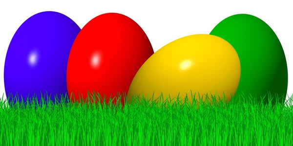 Цветные пасхальные яйца в траве — стоковое фото