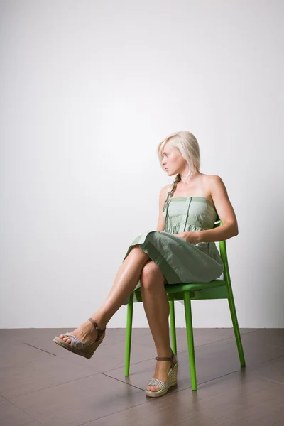 Pretty sitting on chair — Stock Photo, Image