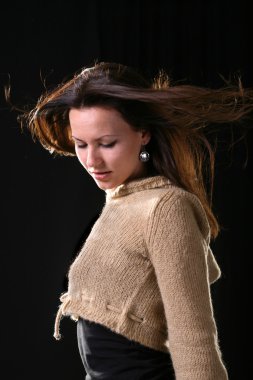 Woman hair quivering on wind portrait clipart