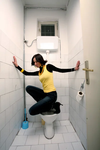 Woman in public toilet — Stock Photo, Image