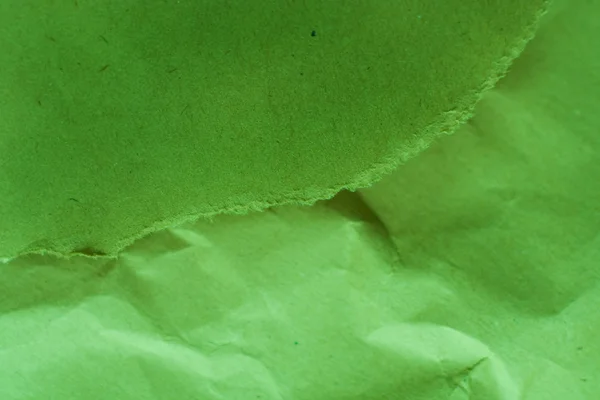 Krossade papper grön bakgrund — Stockfoto