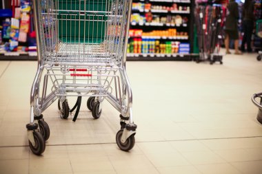 Shopping cart in supermarket clipart