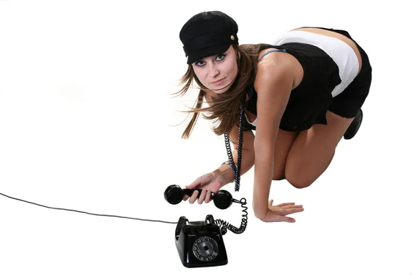 Девушка с черным старым телефоном — стоковое фото