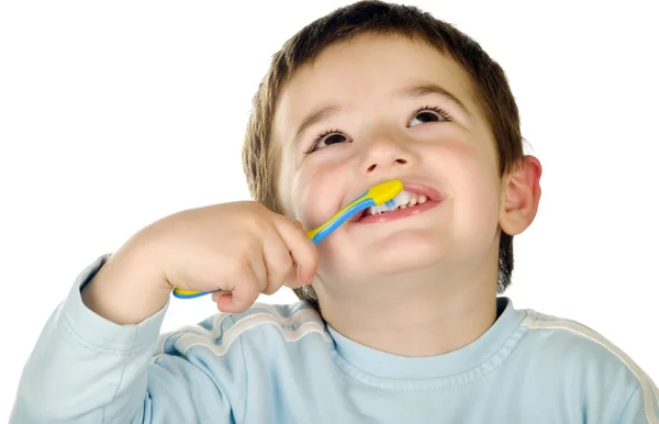 Jovem rapaz limpa os dentes — Fotografia de Stock