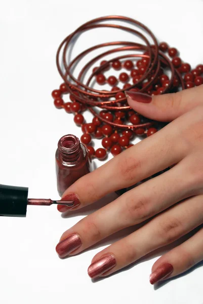 stock image A set of red jewelry and nail polish