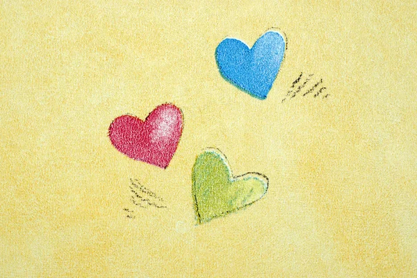 Três corações na parede Imagem De Stock