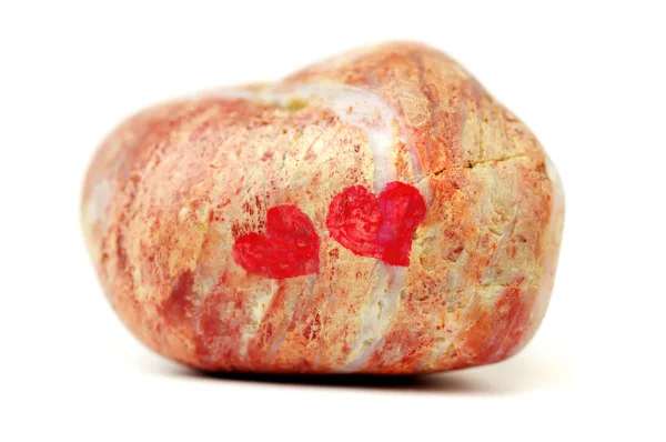 Piedra con corazones. Aislado sobre blanco Imagen De Stock