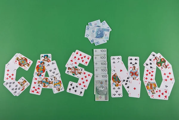 stock image CASINO inscription with cards and money.