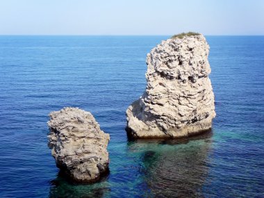 Two rocks at the sea clipart