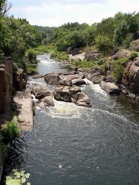 stock image Rapid stream washes granit blocks