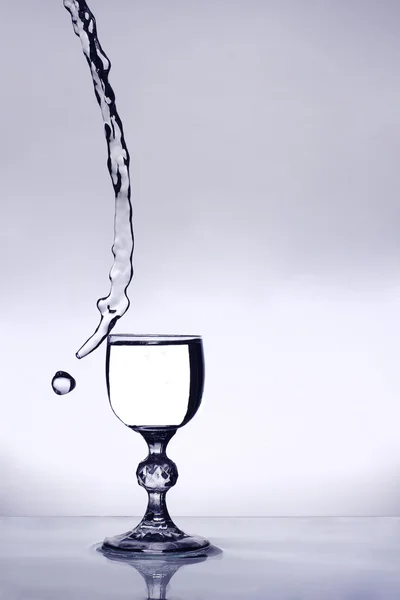 Wine glas on steam of water — Stock Photo, Image