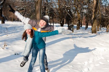 Couple playing in snow clipart