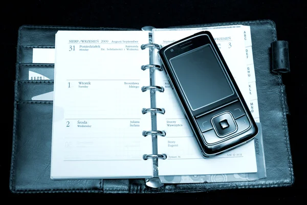 Caderno e telefone — Fotografia de Stock