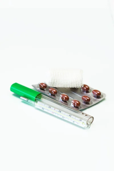 stock image Thermometer, capsul and bandage