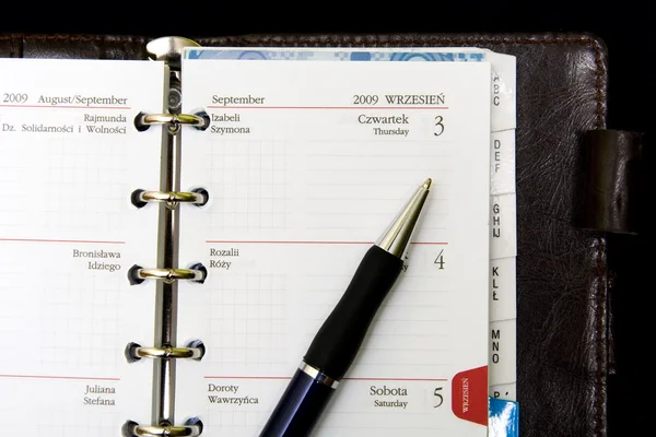 Caderno, calendário e caneta — Fotografia de Stock