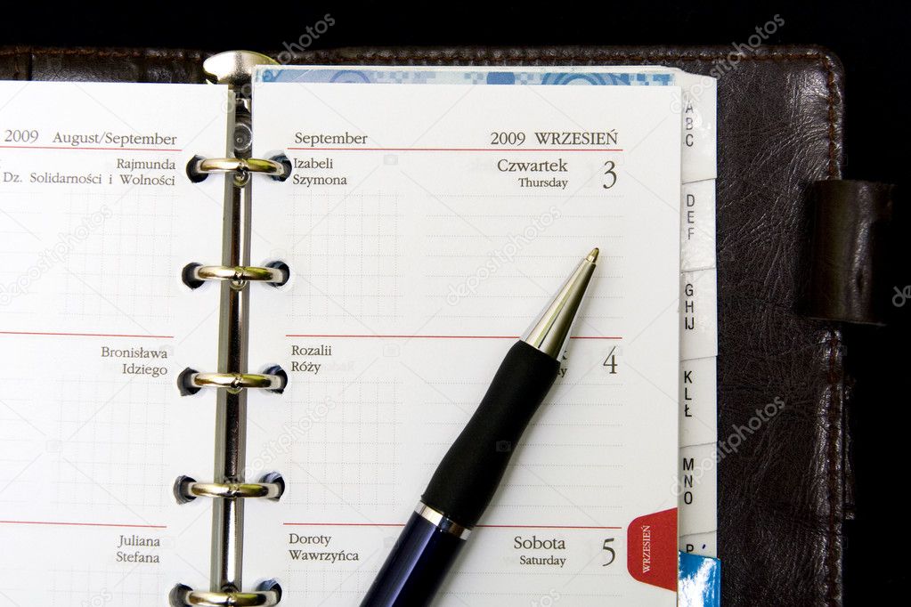 Notebook, calendar and pen