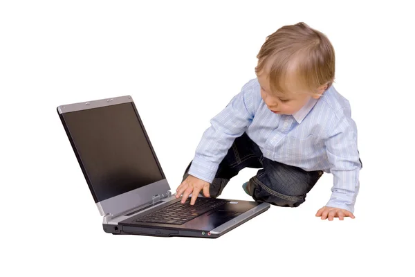 Stock image Young boy with laptop